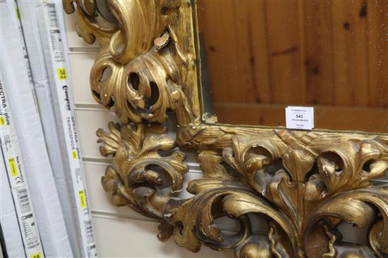 An 18th century Italian carved giltwood wall mirror, 3ft x 2ft 8in.